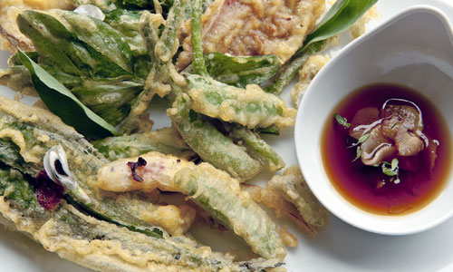 Crispy golden Tempura Veg Plate arranged on parchment paper